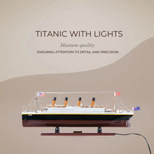 Model of the Titanic with lights on a beige background